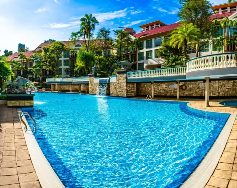 Outdoor Swimming Pool with Waterfall and Terrace in Singapore City Center