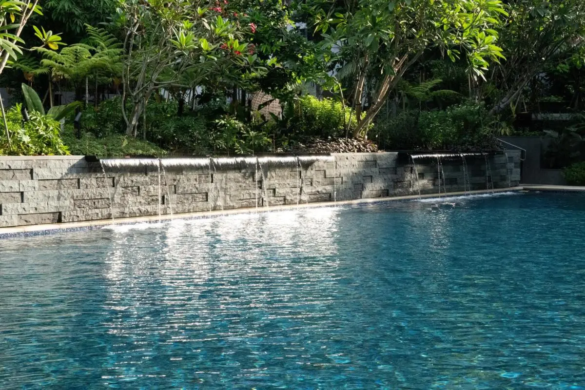 Grand Hyatt Singapore Outdoor Swimming Pool with Waterfall Features and Greenery in Orchard