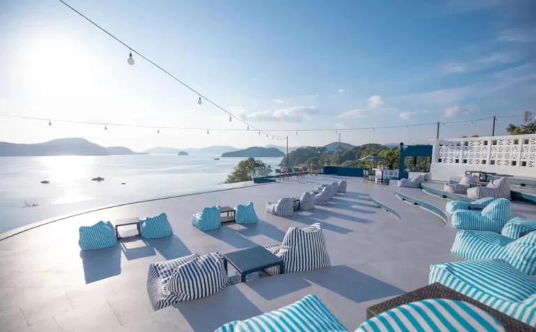 Outdoor Terrace with Panoramic Water Views and Comfortable Bean Bag Seating at Panwa Beach