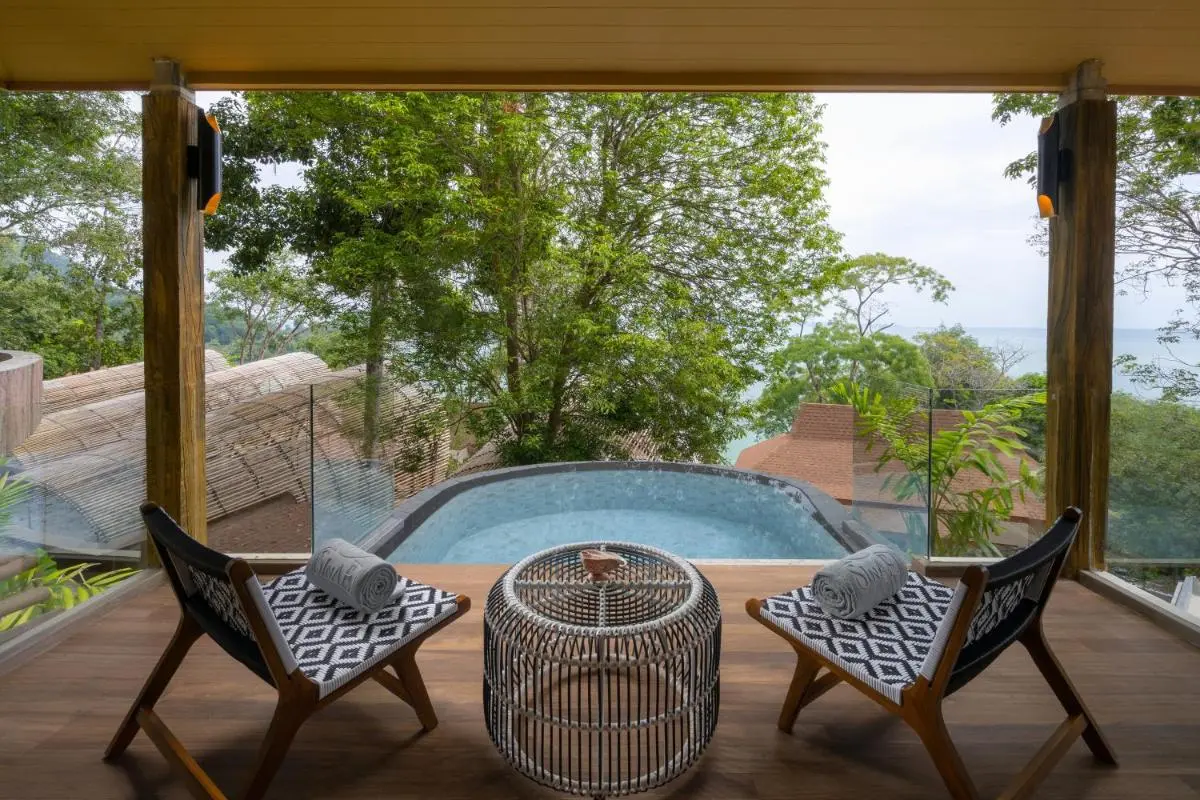 Outdoor Terrace with Plunge Pool Overlooking Lush Greenery and Water Views in Phuket Town
