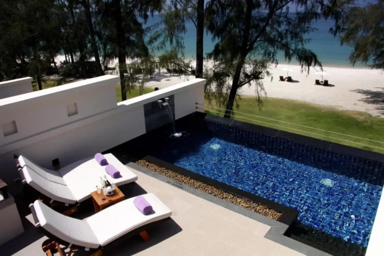 Outdoor Terrace with Rectangular Pool and Lounge Chairs Overlooking Bang Tao Beach