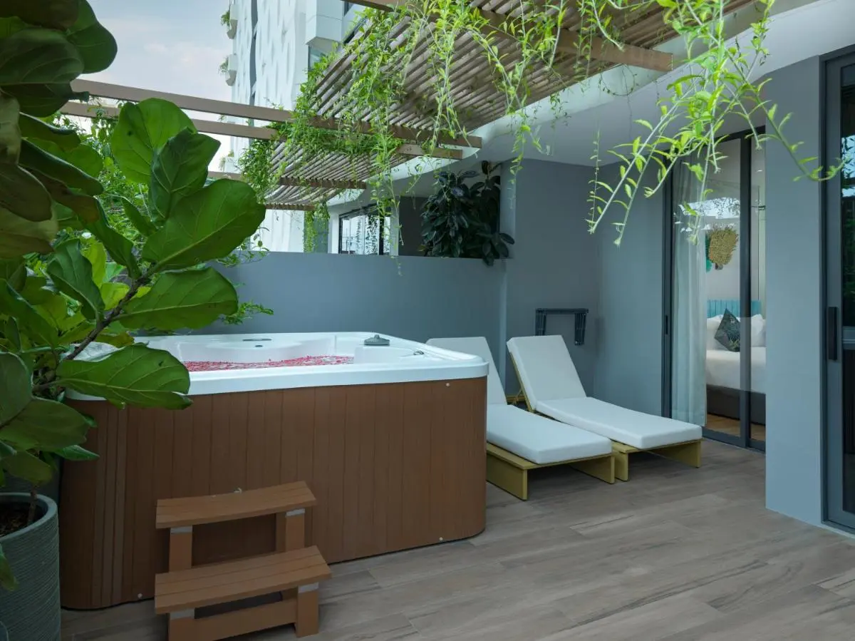 Outdoor Terrace with Wooden Hot Tub and Lounge Chairs at Bang Tao Beach