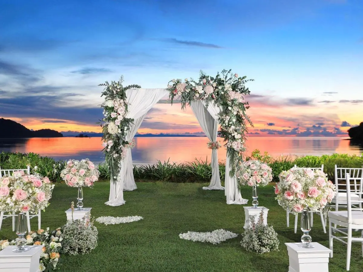 Outdoor Wedding Ceremony Setup by Calm Waterfront at Panwa Beach Sunset