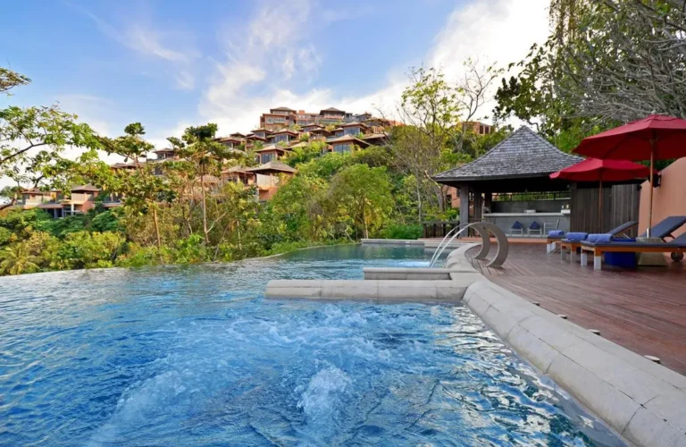 Outdoor Wellness Area Featuring Jacuzzi, Infinity Pool, and Wooden Deck at Panwa Beach