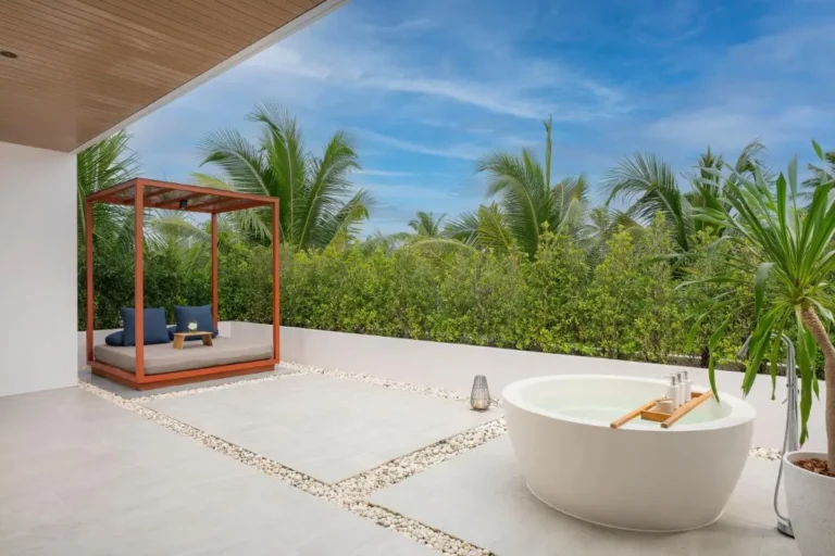 Outdoor Wellness Area with Circular Bathtub and Daybed Near Mai Khao Beach