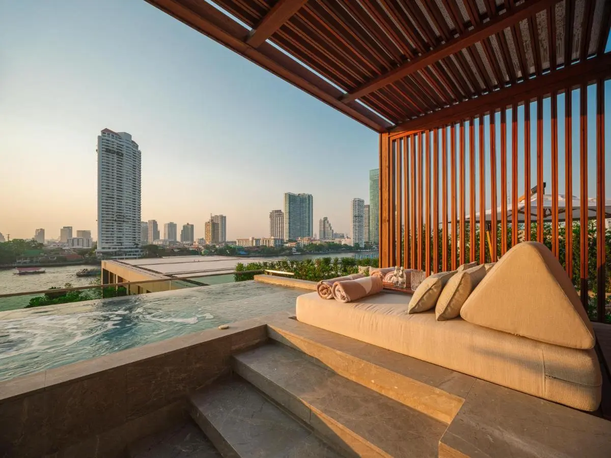 Outdoor Wellness Area with Jacuzzi and Lounge Overlooking Sathorn Waterfront Cityscape