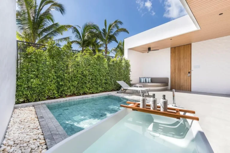 Outdoor Wellness Area with Pool, Bathtub, and Lounge Seating at Mai Khao Beach