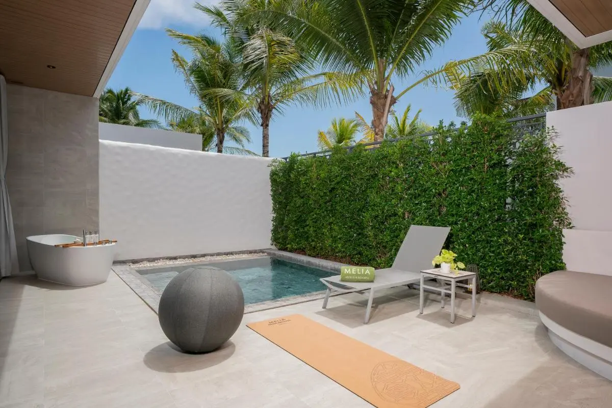 Outdoor Wellness Area with Pool, Bathtub, and Yoga Space Near Mai Khao Beach