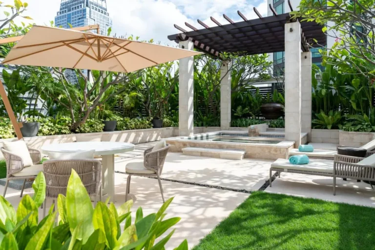 Outdoor Wellness Area with Pool, Lounge Chairs, and Pergola in Pathumwan Bangkok