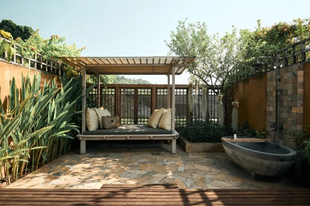 Outdoor Wellness Area with Stone Bathtub and Wooden Pergola at Patong Beach