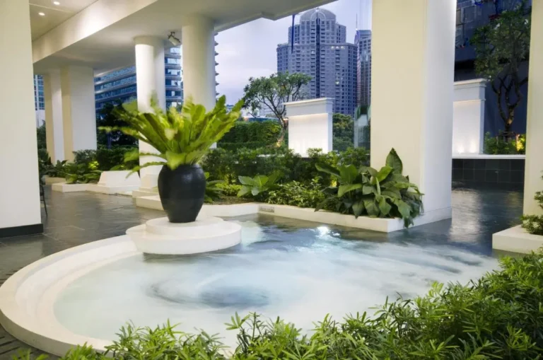 Outdoor Whirlpool Jacuzzi and Landscaped Wellness Area with City Views in Pathumwan Bangkok