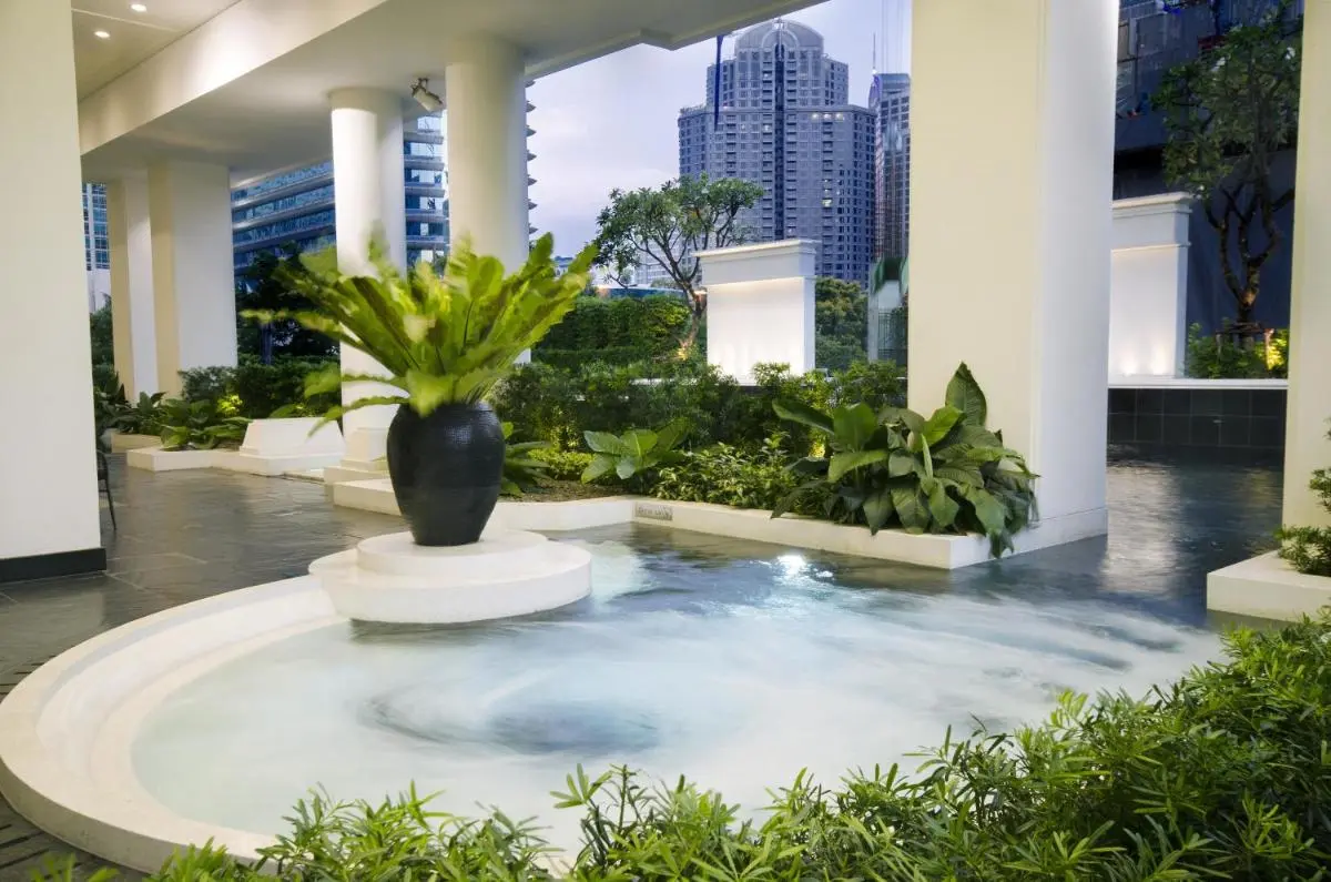 Outdoor Whirlpool Jacuzzi and Landscaped Wellness Area with City Views in Pathumwan Bangkok