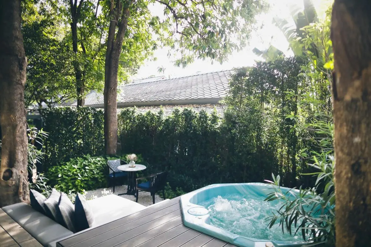 The Raweekanlaya Bangkok Wellness Cuisine Resort Private Outdoor Jacuzzi and Seating Area Surrounded by Lush Greenery in Phra Nakhon Thailand