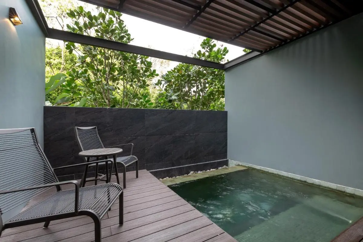 Private Outdoor Pool Area with Wooden Deck and Minimalist Design at Patong Beach