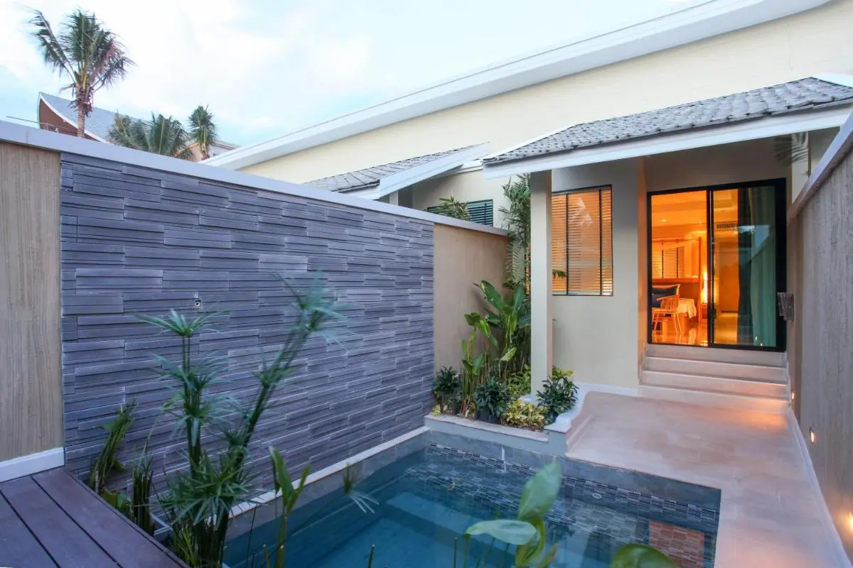 Private Outdoor Rectangular Pool with Mosaic Tiles and Stone Wall in Phuket Town