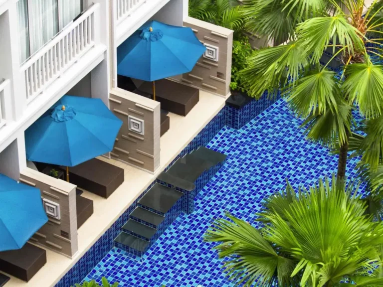 Private Pool Area with Blue Mosaic Tiles and Shaded Seating Alcoves at Patong Beach