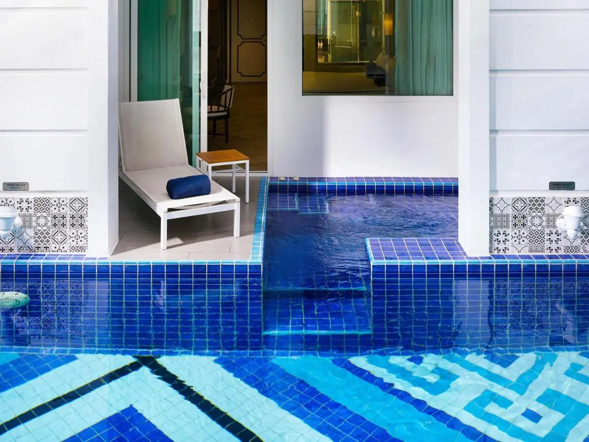 Mövenpick Myth Hotel Patong Phuket Private Pool Area with Tiled Blue Geometric Patterns and Adjacent Patio in Patong Beach