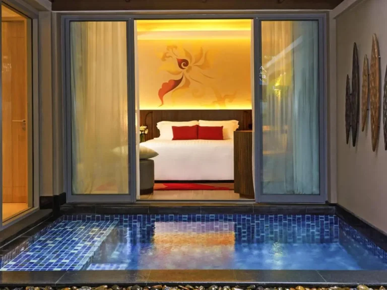 Private Rectangular Blue Mosaic Tiled Pool Adjacent to Cozy Bedroom in Patong Beach