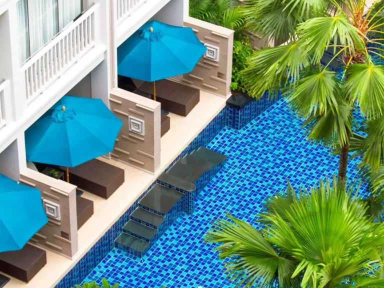 Private Swimming Pool Area with Blue Mosaic Tiles and Lounge Seating at Patong Beach