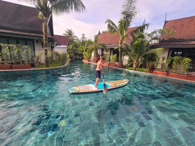 Rectangular Swimming Pool with Paddleboarding and Tropical Surroundings in Thalang