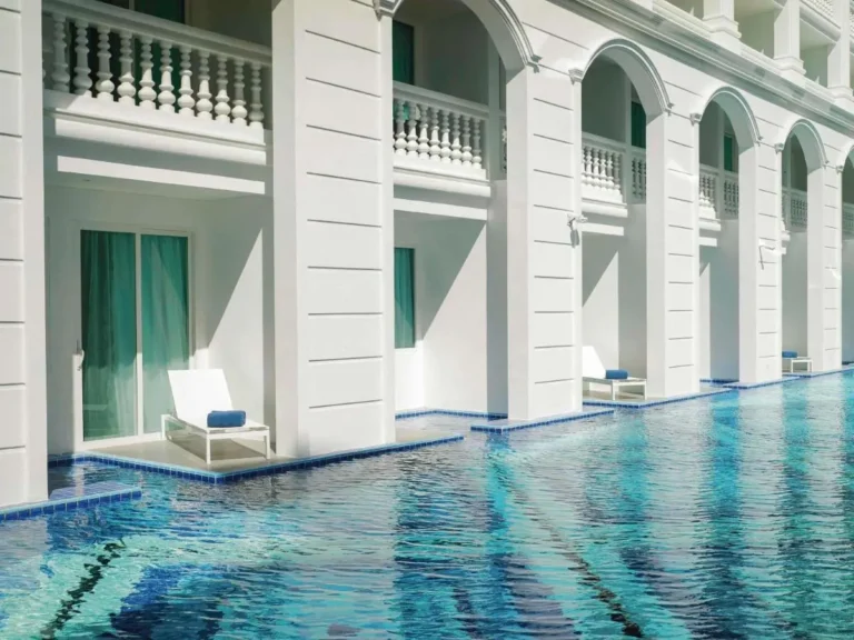 Rectangular Swimming Pool with Private Patio Lounges and Classical Architecture at Patong Beach