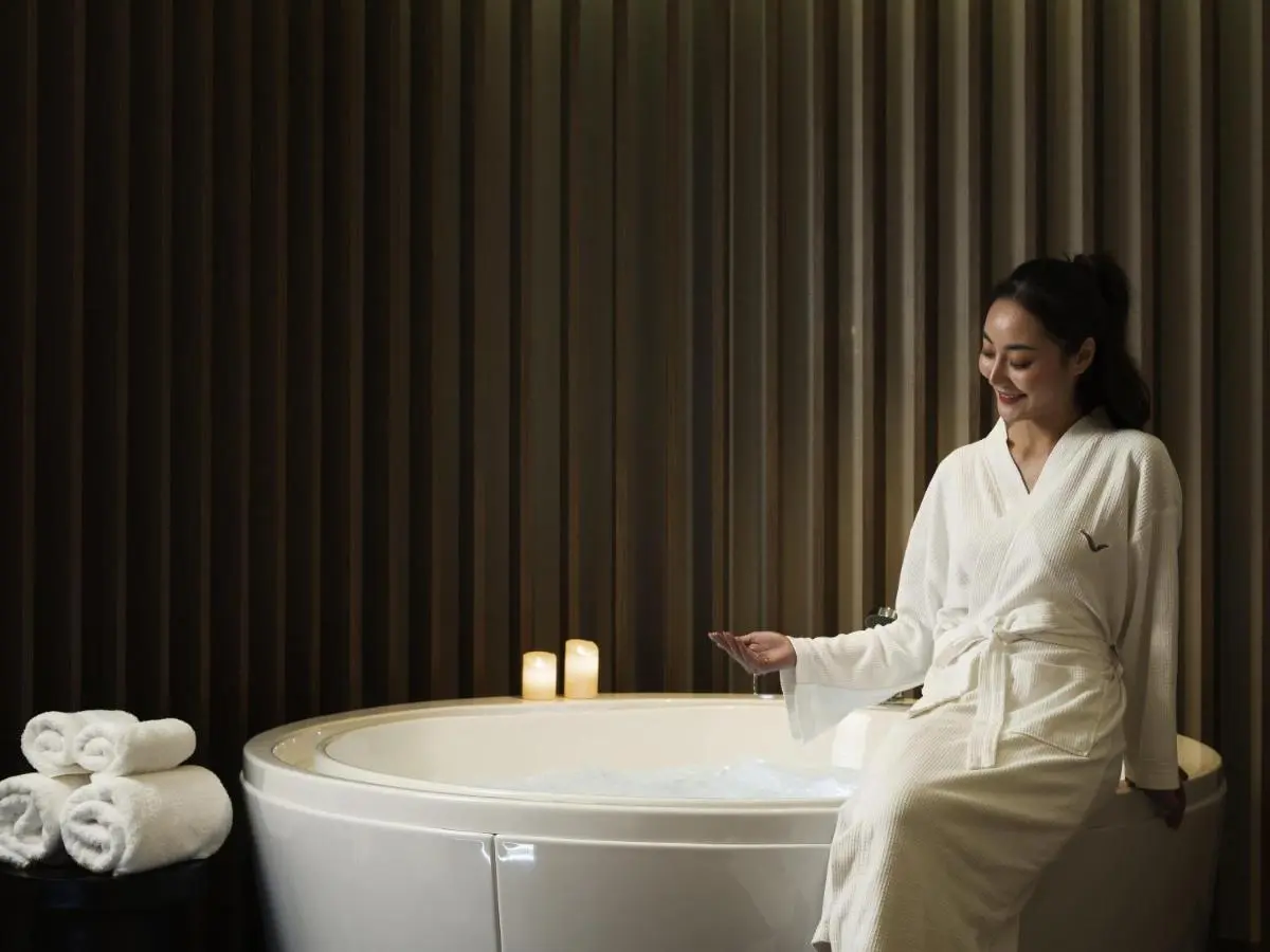 Mövenpick BDMS Wellness Resort Bangkok Relaxing Indoor Jacuzzi and Spa Setting with Candles and Towels in Pathumwan