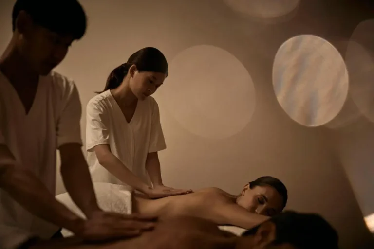 Relaxing Indoor Massage Therapy Session in Sathorn Wellness Center with Warm Lighting