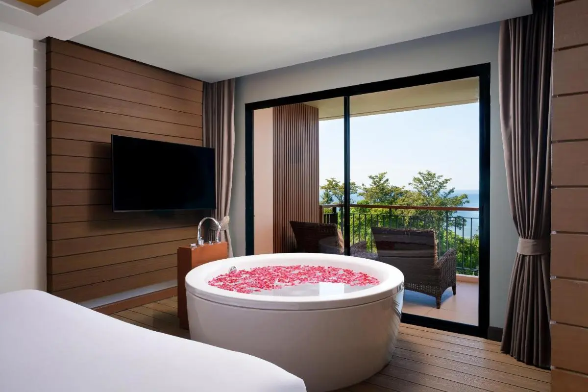 Relaxing Indoor Round Bathtub with Rose Petals and Ocean View at Kata Beach