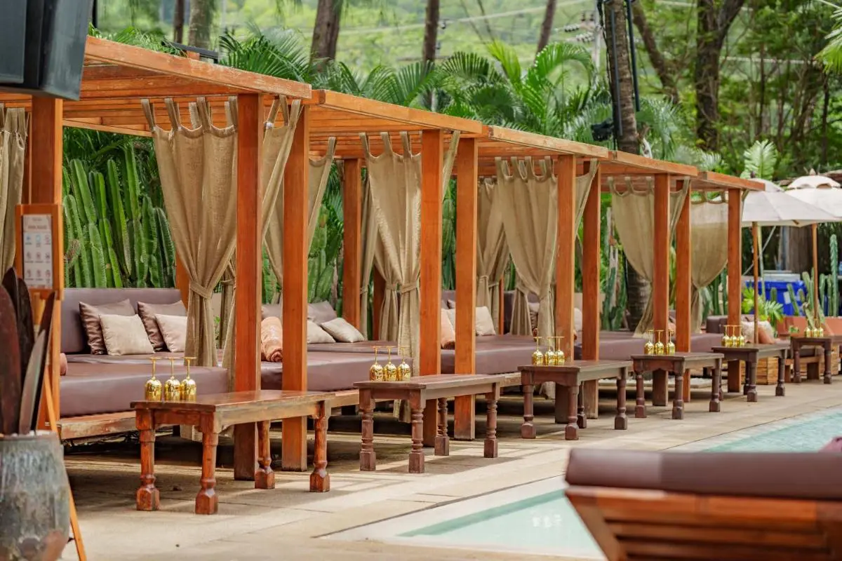 Relaxing Poolside Cabanas with Cushioned Seating and Tropical Surroundings at Kamala Beach