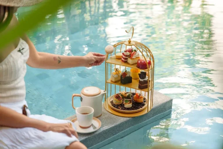 Relaxing Poolside Scene with Desserts and Tea at Mai Khao Beach
