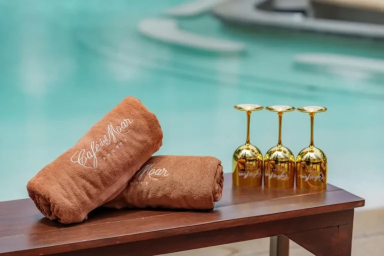 Relaxing Poolside Setting with Towels and Wine Glasses at Kamala Beach