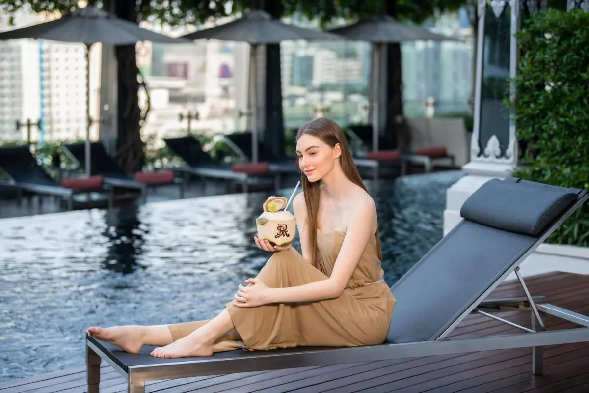 Relaxing Rooftop Infinity Pool and Lounge Area with City Views in Pathumwan Bangkok