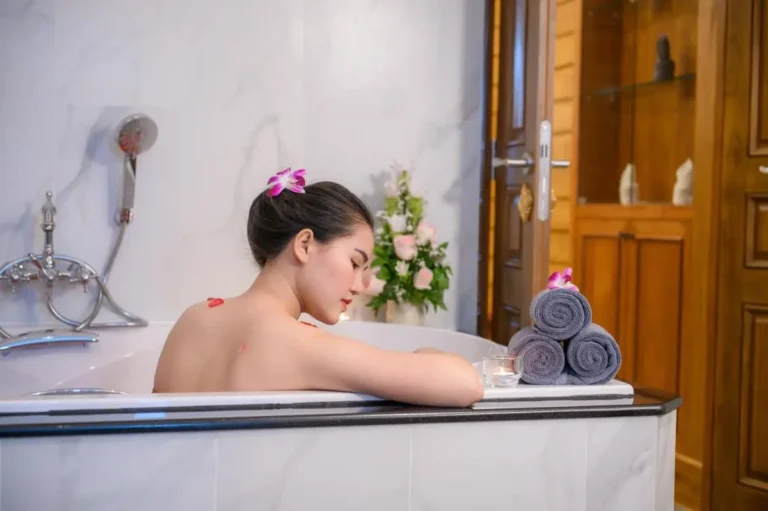 Relaxing Spa Bathroom with Marble Bathtub and Floral Decor in Chang Khlan Chiang Mai