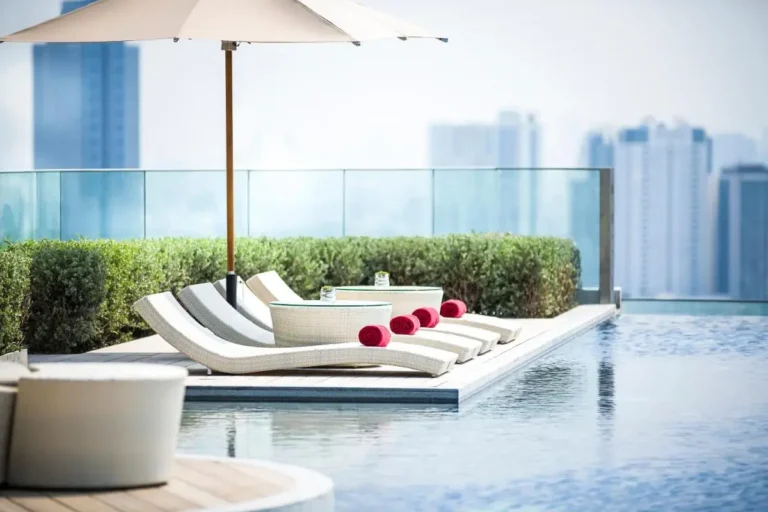 Rooftop Infinity Pool and Lounge Area with City View in Thonburi Bangkok