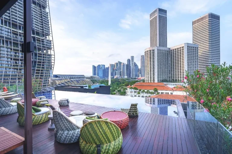 Rooftop Infinity Pool and Lounge Area with City Views in Singapore
