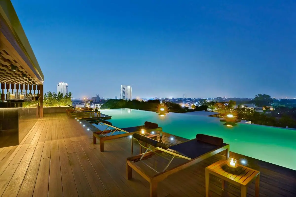 Rooftop Infinity Pool and Lounge Area with Cityscape Views in Chang Khlan Chiang Mai