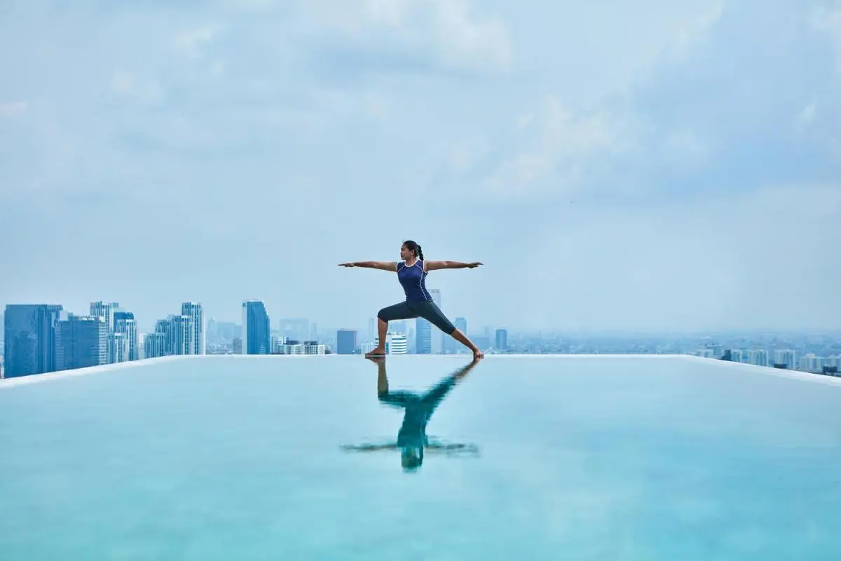 Rooftop Infinity Pool and Yoga Practice with Cityscape Views in Wattana Bangkok