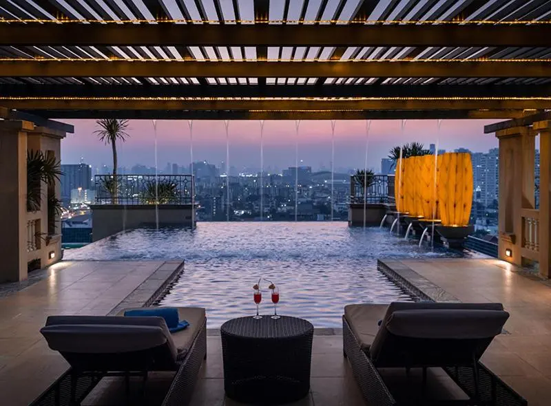 The Grand Fourwings Convention Hotel Bangkok Rooftop Infinity Pool with Ambient Lighting and City Views in Bangkapi Bangkok