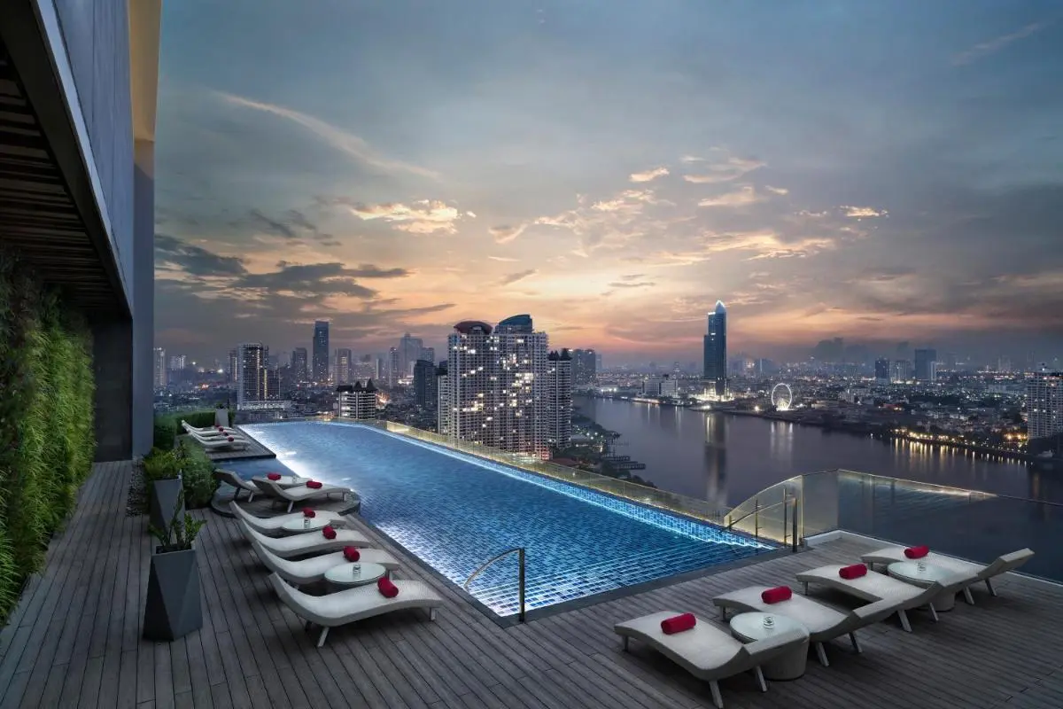 Avani Plus Riverside Bangkok Hotel Rooftop Infinity Pool with City Views and Lounge Area in Thonburi Bangkok Thailand
