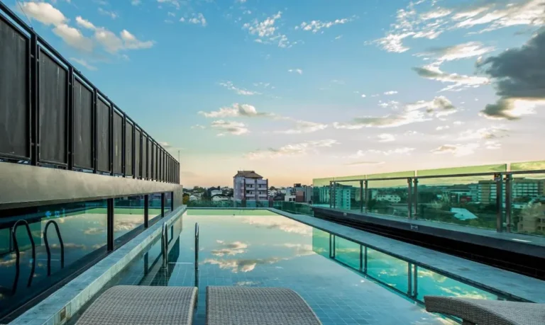 Rooftop Infinity Pool with City Views and Lounge Chairs in Chiang Mai