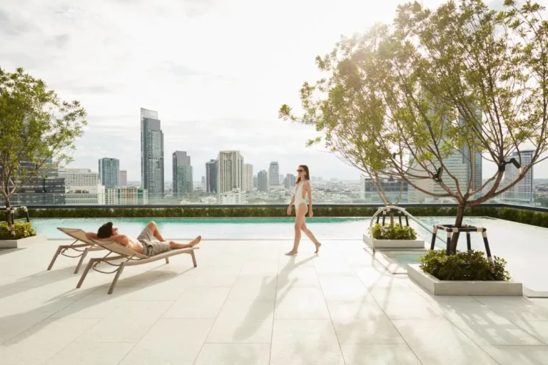 Rooftop Infinity Pool with Cityscape Views and Relaxation Area in Bang Rak Bangkok