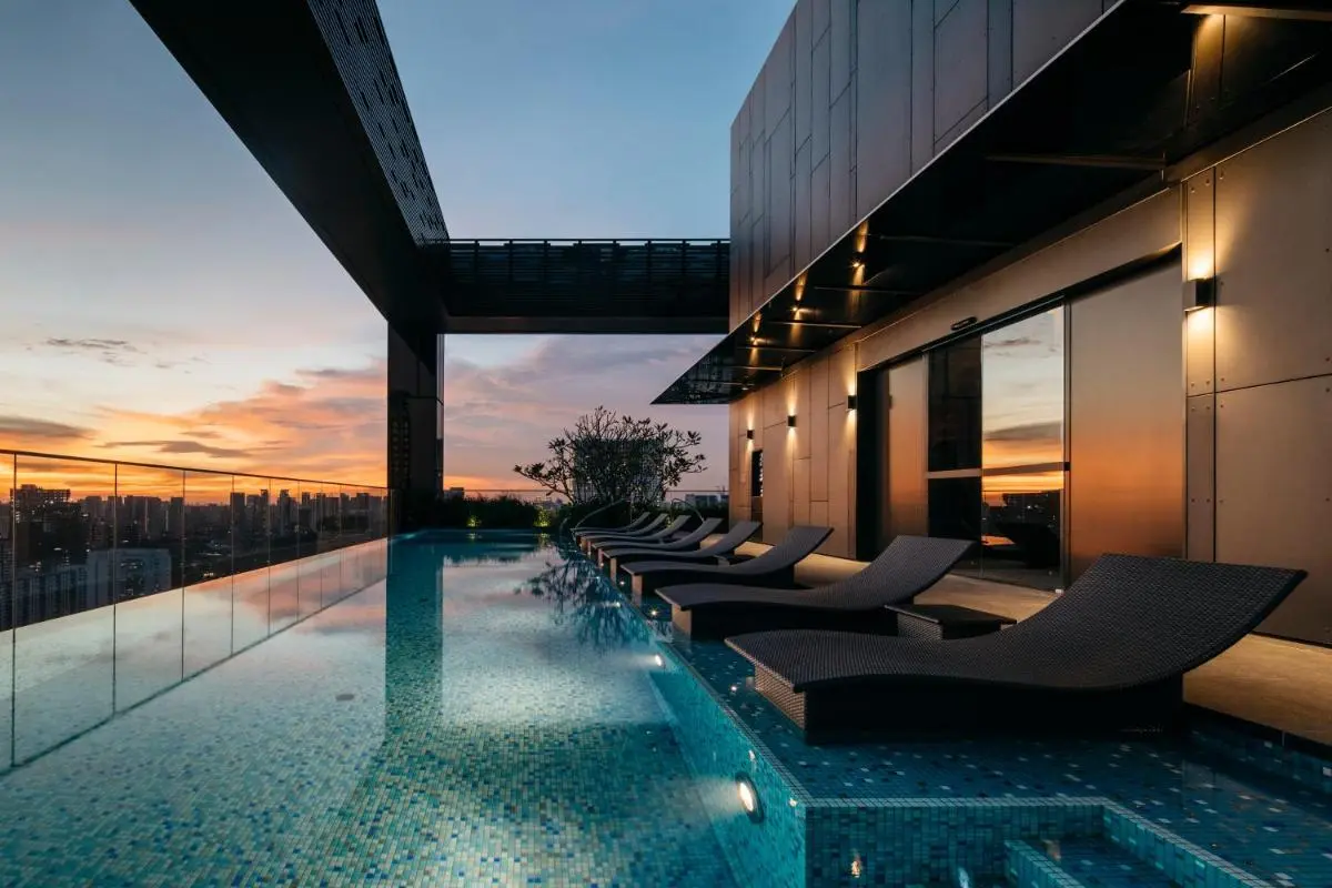 Rooftop Infinity Pool with Lounge Seating and City Views in Singapore