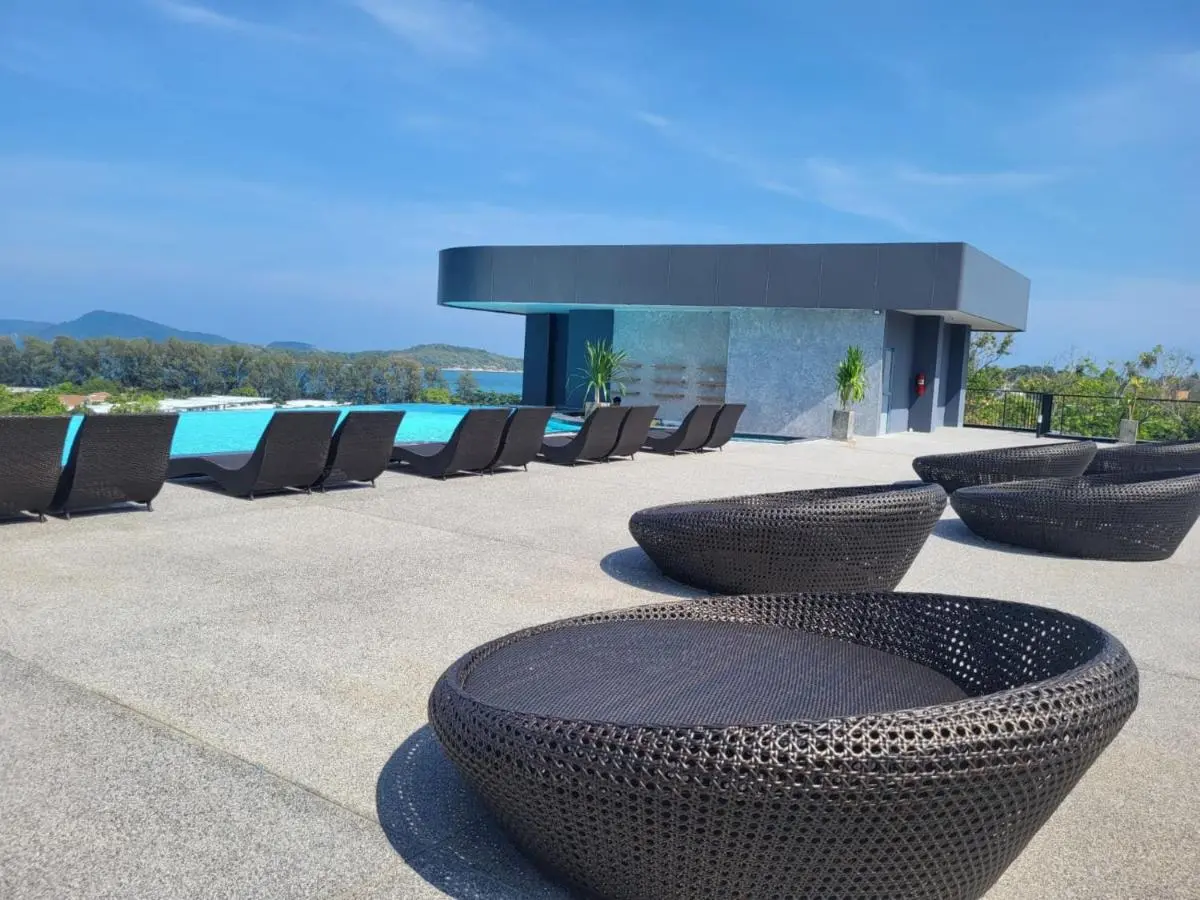 Rooftop Infinity Pool with Scenic Views and Modern Lounge Seating at Rawai Beach