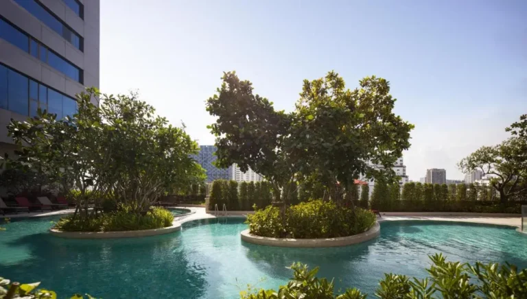 Rooftop Outdoor Swimming Pool with Curved Islands and City Views in Ratchathewi Bangkok