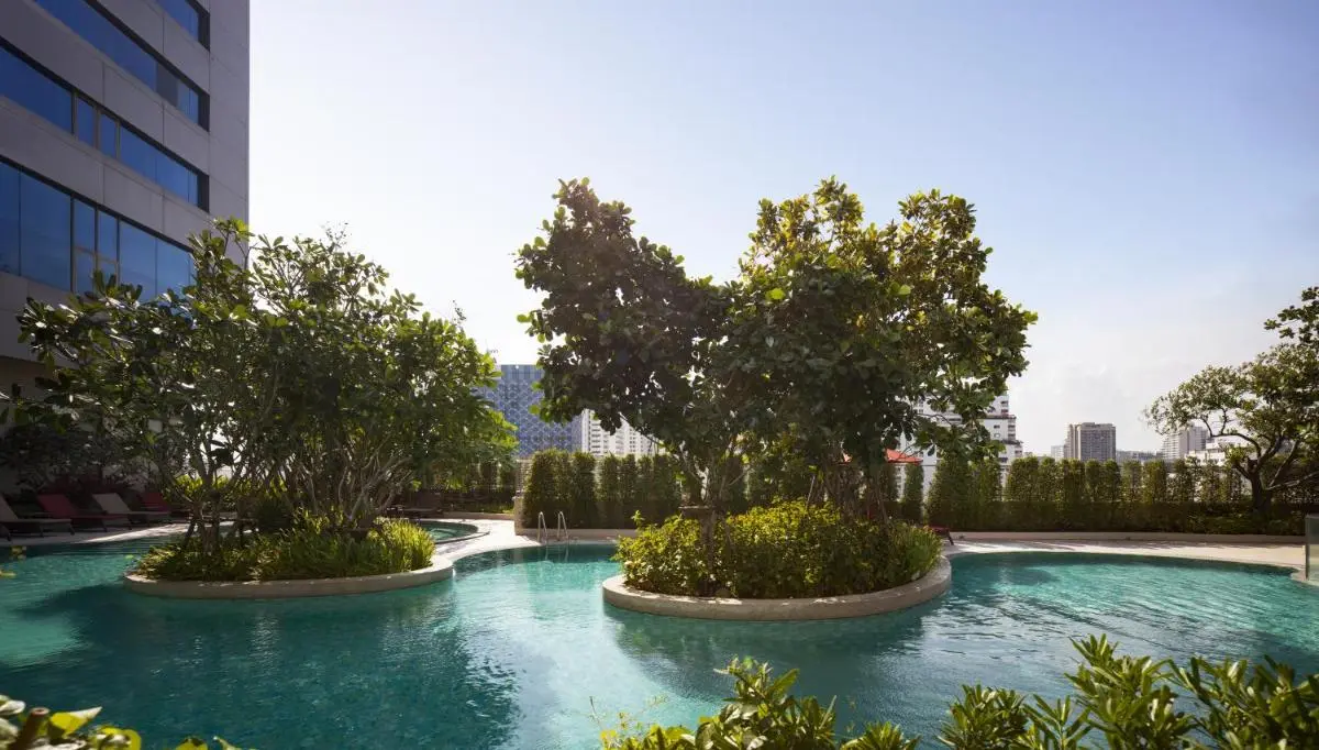 Rooftop Outdoor Swimming Pool with Curved Islands and City Views in Ratchathewi Bangkok