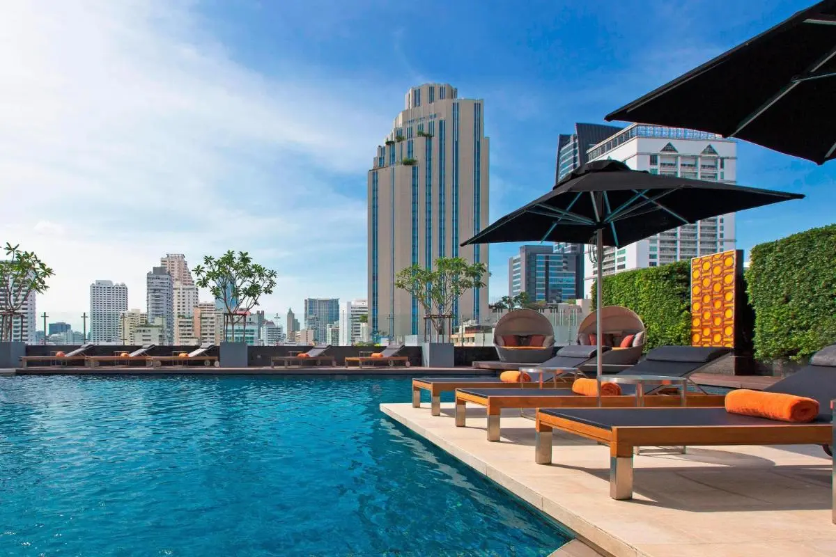 Rooftop Pool and Lounge Area with City Skyline Views in Wattana Bangkok