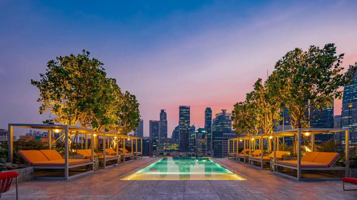 Mondrian Singapore Duxton Rooftop Pool Area with Lounge Beds and City Views in Chinatown Singapore