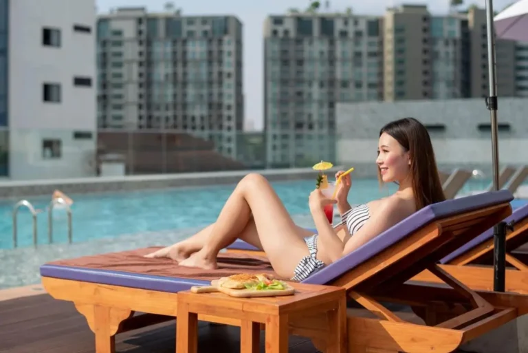 Rooftop Pool Area with Lounge Chair and Urban Views in Chang Khlan Chiang Mai