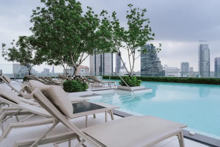 Rooftop Pool Area with Lounge Chairs and City Views in Bang Rak Bangkok Rooftop Pool Area with Lounge Chairs and City Views in Bang Rak Bangkok