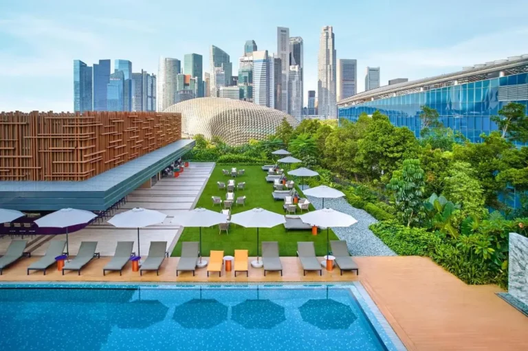 Rooftop Pool Area with Lounge Chairs and City Views in Marina Bay Singapore